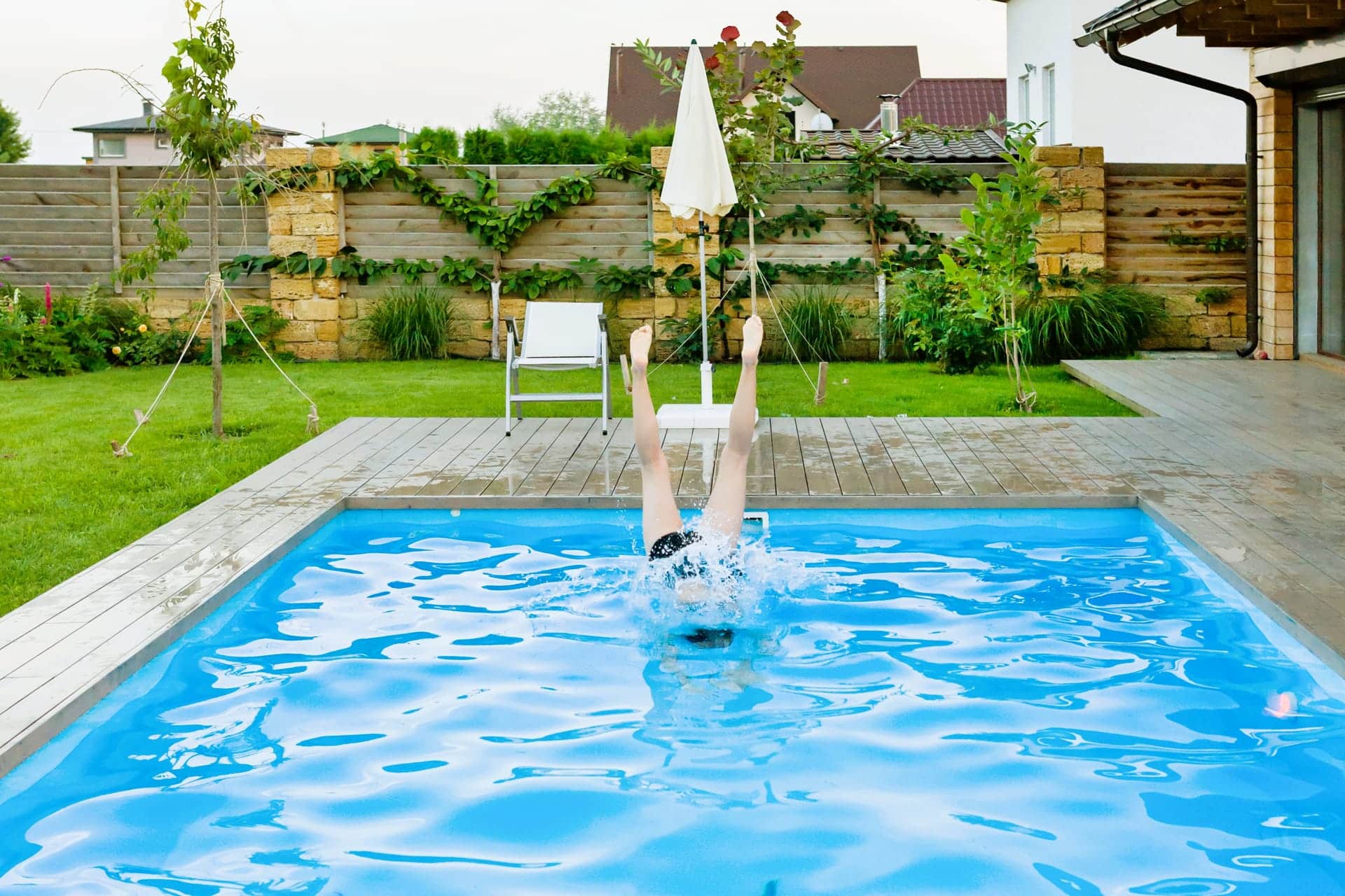 girl-jumps-into-the-pool